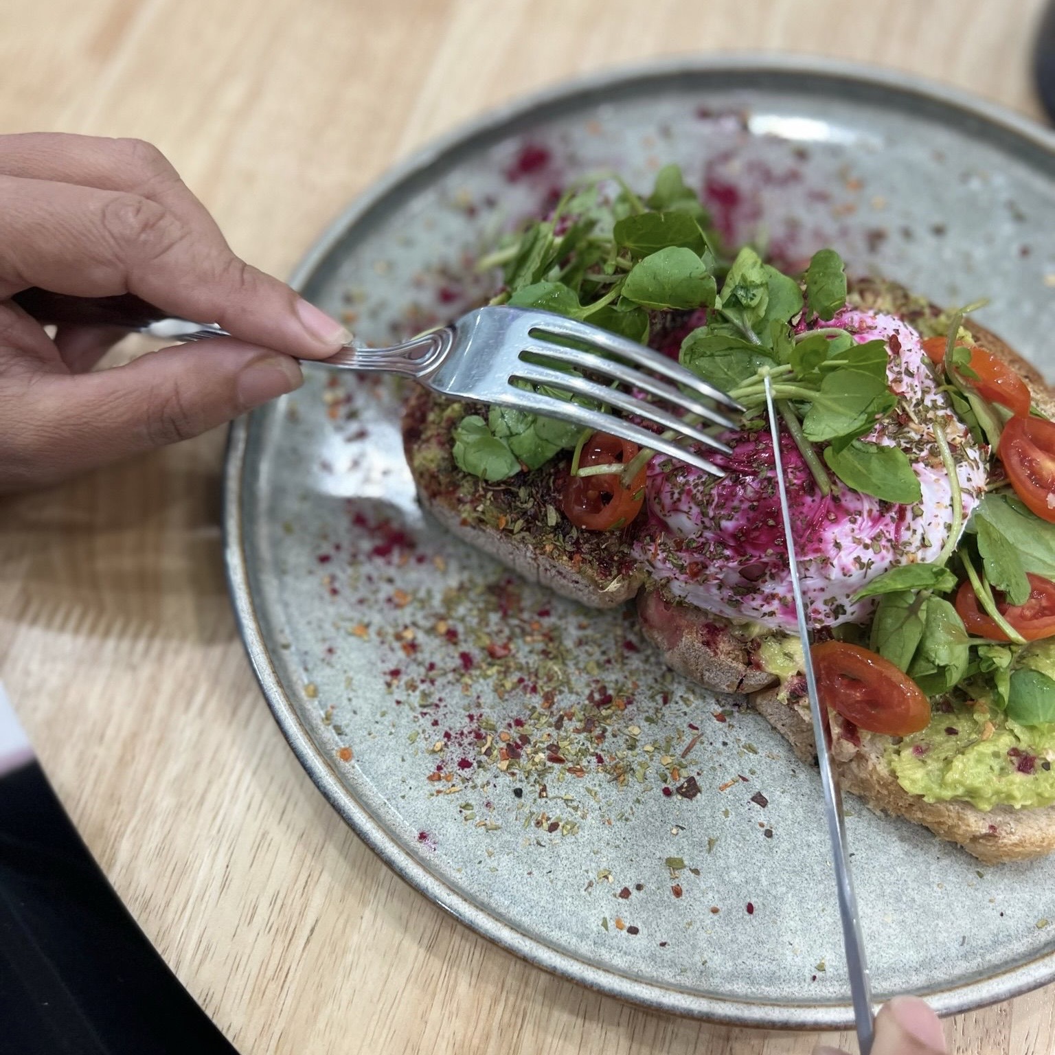 Mafra bread, guacamole, poached egg, cherry tomato, beetroot, spices, micro-herbs